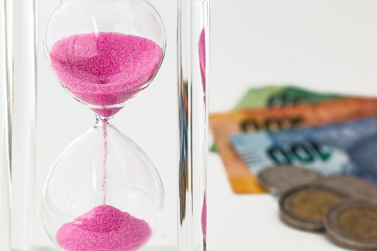 Hourglass, money, time — Social Security Disability Benefits: Common Myths and Facts